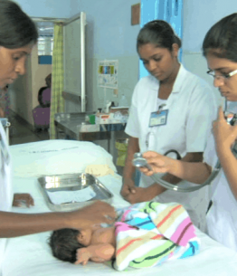 nurses check a new bordn child