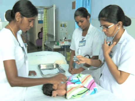nurses check a new bordn child