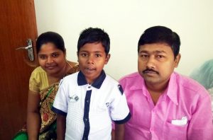 Kamu with his parents in the medical genetics at CMC Vellore outpatients