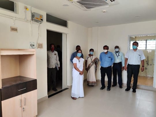 staff pose for a photo in the centre just before the dedication