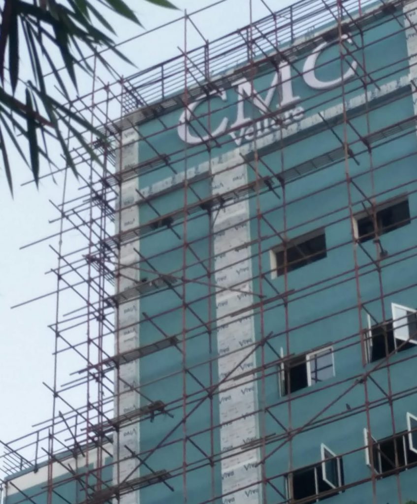 top of the new orthopaedic block with the CMC Vellore sign on it