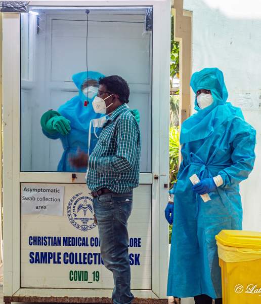 Man stands readyt to have his swab taken